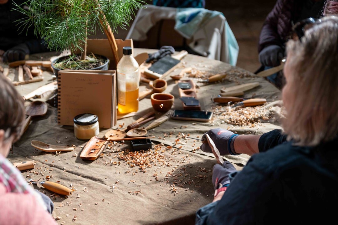Seniors making handicrafts together at a workshop table